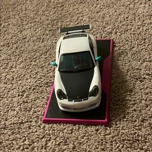 White and Black Porsche Model Car